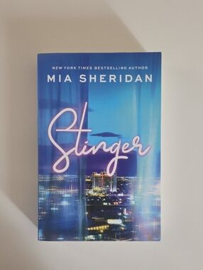 Stinger by Mia Sheridan - Blue Hardcover Book